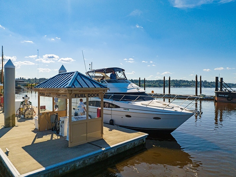 A boat tied up to a dock at Swantown Marina in Olympia